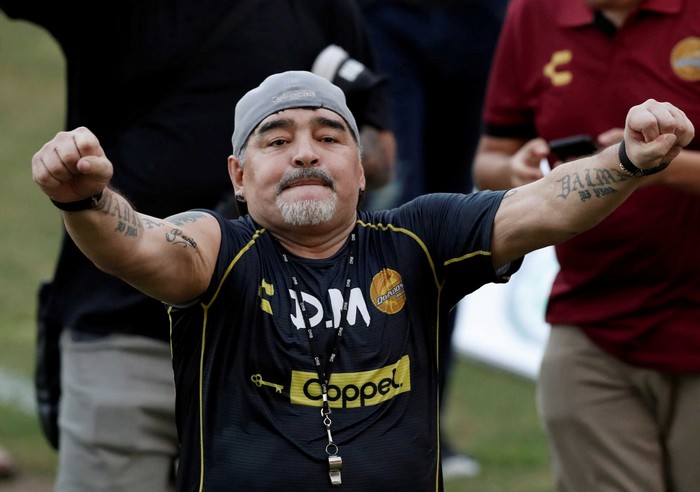 FILE PHOTO: Argentinian soccer legend Diego Armando Maradona reacts to fans during his first training session as coach of Dorados at the Banorte stadium in Culiacan, in the Mexican state of Sinaloa, Mexico September 10, 2018. REUTERS/Henry Romero/File Photo