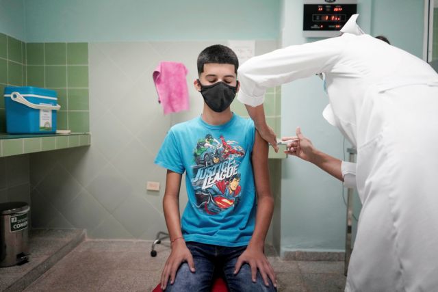 Cristian Artimbau, 14, gets a dose of the Soberana 02 vaccine during its clinical trials at a hospital amid concerns about the spread of the coronavirus disease (COVID-19) in Havana, Cuba, June 29, 2021. REUTERS/Alexandre Meneghini