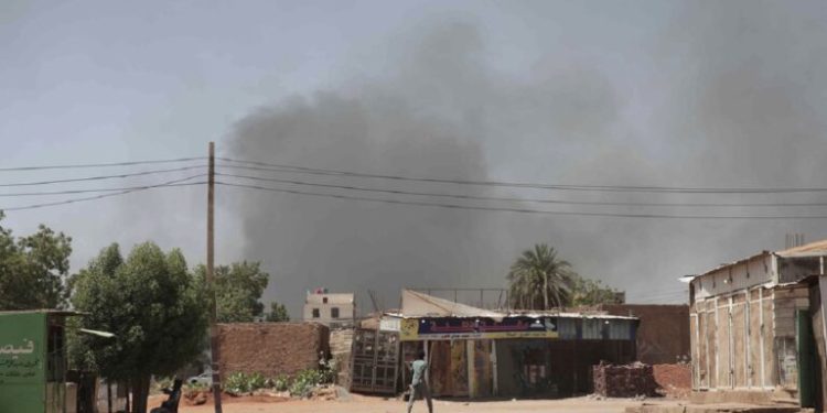 Smoke rises in Khartoum, Sudan, Wednesday, May 3, 2023. Many people are fleeing the conflict in Sudan between the military and a rival paramilitary force. (AP Photo/Marwan Ali)