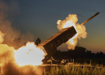 A Russian TOS-1A Solntsepyok heavy flamethrower rocket launcher, captured by the Ukrainian army battalion "Da Vinci", fires towards the Russian positions on the frontline near Kreminna, Luhansk region, Ukraine, Friday, July 7, 2023. Writing on its body reads "Da Vinci", a code name of the battalion commander Dmytro Kotsiubaylo, who was killed in battle. (AP Photo/Libkos)