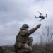 A Ukrainian serviceman of the 68 Oleksa Dovbush hunting brigade, launches a drone at the frontline near Vuhledar, Ukraine, Wednesday, Feb. 22, 2023. (AP Photo/Evgeniy Maloletka)