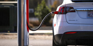 PETALUMA, CALIFORNIA - SEPTEMBER 23: A Tesla car sits parked at a Tesla Supercharger on September 23, 2020 in Petaluma, California. California Gov. Gavin Newsom signed an executive order directing the California Air Resources Board to establish regulations that would require all new cars and passenger trucks sold in the state to be zero-emission vehicles by 2035. Sales of internal combustion engines would be banned in the state after 2035. (Photo by Justin Sullivan/Getty Images)