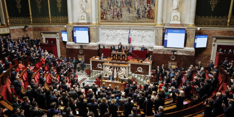 epa10533908 Standing ovation by French deputies after the announcement of the release of French journalist Olivier Dubois, at the National Assembly in Paris, France, 20 March 2023. Dubois, who was kidnapped in Gao, Mali on 08 April 2021, was released along with a US aid worker.  EPA/TERESA SUAREZ