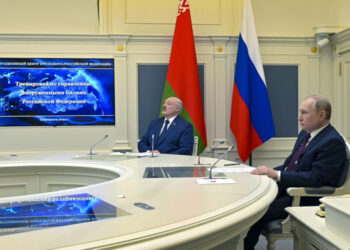 FILE Russian President Vladimir Putin, right, and Belarusian President Alexander Lukashenko watch military drills via videoconference in Moscow, Russia, Saturday, Feb. 19, 2022. The Russian military on Friday announced massive drills of its strategic nuclear forces. Last year, Russia moved some of its tactical nuclear weapons into the territory of its ally Belarus that neighbors Ukraine and NATO members Poland, Latvia and Lithuania. (Alexei Nikolsky, Sputnik, Kremlin Pool Photo via AP, File)