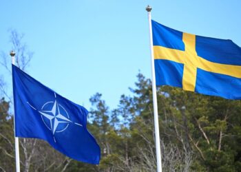 The NATO flag is raised at a ceremony at the Musko navy base near Stockholm, Sweden, March 11, 2024. TT News Agency/Fredrik Sandberg/via REUTERS      ATTENTION EDITORS - THIS IMAGE WAS PROVIDED BY A THIRD PARTY. SWEDEN OUT. NO COMMERCIAL OR EDITORIAL SALES IN SWEDEN.