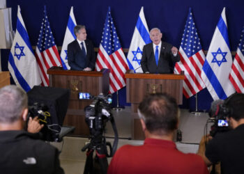 FILE - Israel's Prime Minister Benjamin Netanyahu, right, make statements with Secretary of State Antony Blinken to the media, inside The Kirya, which houses the Israeli Ministry of Defense, after their meeting in Tel Aviv, Oct. 12, 2023. AP Washington photographer Jacquelyn Martin recalls how being one of a few female photographers covering news and politics was useful when she was assigned as the press pooler for Blinken's last-minute trip to Israel and the Middle East in the aftermath of the Hamas attacks. Martin said, “Sometimes people not knowing what to make of you works in your favor.” (AP Photo/Jacquelyn Martin, Pool, File)