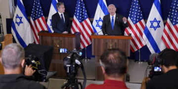 FILE - Israel's Prime Minister Benjamin Netanyahu, right, make statements with Secretary of State Antony Blinken to the media, inside The Kirya, which houses the Israeli Ministry of Defense, after their meeting in Tel Aviv, Oct. 12, 2023. AP Washington photographer Jacquelyn Martin recalls how being one of a few female photographers covering news and politics was useful when she was assigned as the press pooler for Blinken's last-minute trip to Israel and the Middle East in the aftermath of the Hamas attacks. Martin said, “Sometimes people not knowing what to make of you works in your favor.” (AP Photo/Jacquelyn Martin, Pool, File)