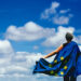 Young woman holding the European Union Flag. Voting concept.