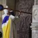 Archbishop of Paris, Bishop Ulrich, knocks on the door of Notre-Dame Cathedral during a ceremony to mark the re-opening of the landmark Cathedral, in central Paris, on December 7, 2024. Around 50 heads of state and government are expected in the French capital to attend the ceremony marking the rebuilding of the Gothic masterpiece five years after the 2019 fire which ravaged the world heritage landmark and toppled its spire. Some 250 companies and hundreds of experts were part of the five-year restoration project at a cost of hundreds of millions of euros. (Photo by Christophe PETIT TESSON / POOL / AFP)