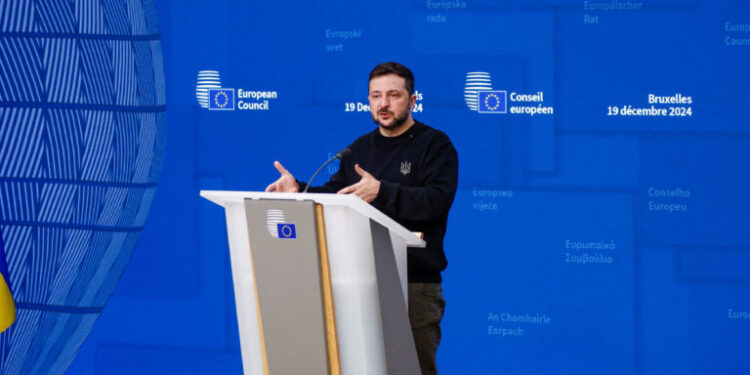 Ukraine's President Volodymyr Zelenskiy speaks as he attends a European Union leaders summit in Brussels, Belgium, December 19, 2024. REUTERS/Johanna Geron