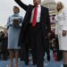 President Donald Trump waves after taking the oath of office from Chief Justice John Roberts, as his wife Melania holds the Bible, daughter Tiffany, Friday, Jan. 27, 2017 on Capitol Hill in Washington. (Jim Bourg/Pool Photo via AP)