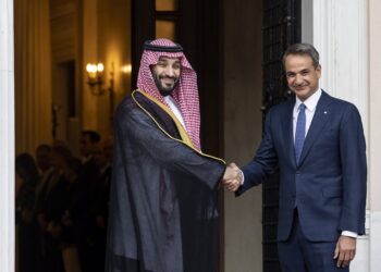 Greek Prime Minister Kyriakos Mitsotakis, right, shakes hands with Saudi Crown Prince Mohammed bin Salman during a welcoming ceremony, in Athens, Tuesday, July 26, 2022. Crown Prince Mohammed bin Salman is visiting Greece Tuesday on his first trip to a European Union country since the killing in 2018 of Saudi journalist Jamal Khashoggi. (AP Photo/Yorgos Karahalis, Pool)