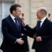 French President Emmanuel Macron welcomes German Chancellor Olaf Scholz as he arrives for a meeting with European leaders on Ukraine and European security at the Elysee Palace in Paris, France, February 17, 2025. REUTERS/Abdul Saboor