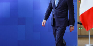 Greek Prime Minister Kyriakos Mitsotakis walks to attend a European Union summit in Brussels, Belgium March 20, 2025. REUTERS/Yves Herman