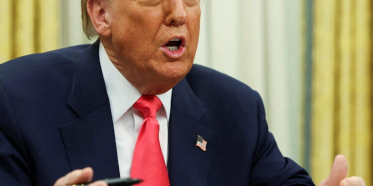 FILE PHOTO: U.S. President Donald Trump speaks in the Oval Office, on the day he signs executive orders, at the White House in Washington, D.C., U.S. March 6, 2025. REUTERS/Evelyn Hockstein/File Photo