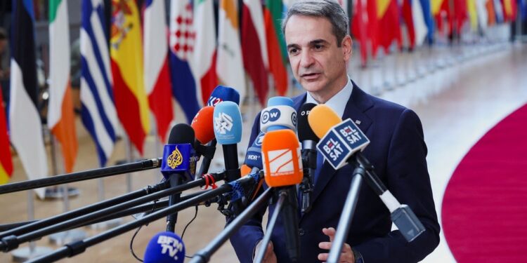 Greek Prime Minister Kyriakos Mitsotakis talks to the press as he attends a European Union summit in Brussels, Belgium March 20, 2025. REUTERS/Yves Herman