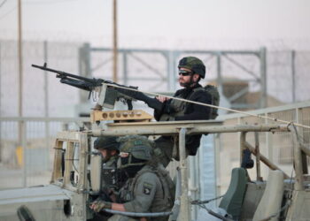 epa11672376 Israeli soldiers patrol at the border gate after Jordanian aid trucks passed through the Erez crossing on the border with northern Gaza Strip, in southern Israel, 21 October 2024. According to the Israeli Army (Tsahal) and COGAT (Coordination of Government Activities in the Territories), 55 Jordanian aid trucks crossed from Israel into the northern Gaza Strip. In total 200 aid trucks entered through Erez, crossing to the northern Gaza Strip since 15 October 2024.  EPA/ABIR SULTAN