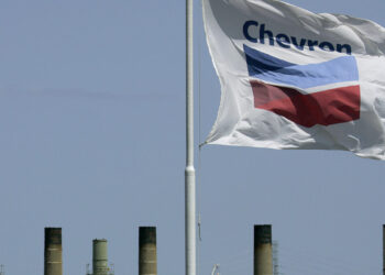 FILE - This April 21, 2008 file photo shows a Chevron flag flying over the Chevron refinery in Richmond, Calif. Chevron Corp. reports quarterly financial results before the market opens on Friday, April 26, 2013. (AP Photo/Ben Margot, File)