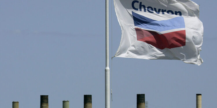 FILE - This April 21, 2008 file photo shows a Chevron flag flying over the Chevron refinery in Richmond, Calif. Chevron Corp. reports quarterly financial results before the market opens on Friday, April 26, 2013. (AP Photo/Ben Margot, File)