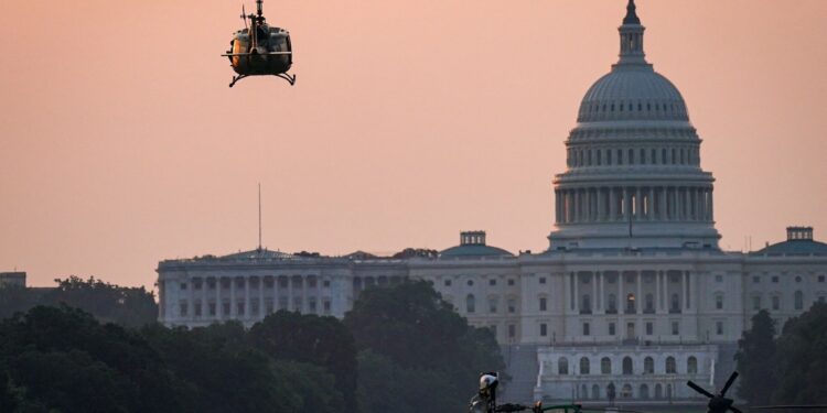 A Bell UH-1 Iroquois military helicopter to be used in the U.S. Army's 250th Birthday Celebration and Parade, prepares to land on the National Mall near the U.S. Capitol in Washington, D.C., U.S., June 11, 2025. REUTERS/Al Drago
