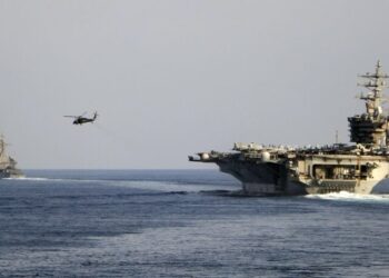 The aircraft carrier USS Dwight D. Eisenhower and other warships crosses the Strait of Hormuz into the Persian Gulf on Sunday, Nov. 26, 2023, as part of a wider American deployment in the Middle East amid the Israel-Hamas war. The Eisenhower was accompanied by the guided-missile cruiser USS Philippine Sea, the guided-missile destroyers USS Gravely and the USS Stethem and the French frigate Languedoc. (Information Technician Second Class Ruskin Naval/U.S. Navy via AP)