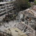 Rescuers and security personnel work at the impacted site after a missile attack from Iran, amid the Iran-Israel conflict in Tel Aviv, Israel June 22, 2025. REUTERS/Tomer Appelbaum ISRAEL OUT. NO COMMERCIAL OR EDITORIAL SALES IN ISRAEL.     TPX IMAGES OF THE DAY
