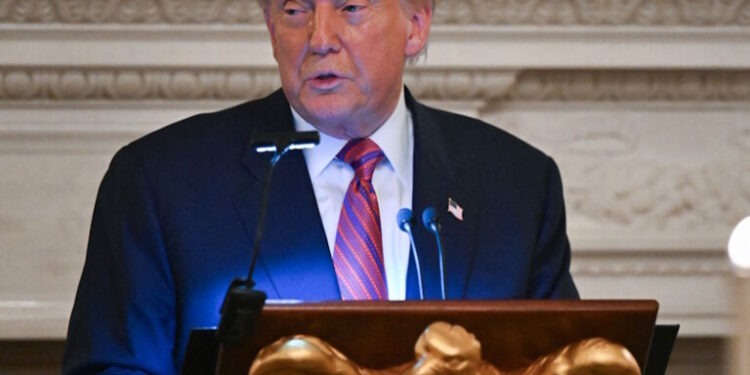 U.S. President Donald Trump speaks at a dinner with Republican Senators, in the State Dining Room at the White House in Washington, D.C., U.S., July 18, 2025. REUTERS/Annabelle Gordon