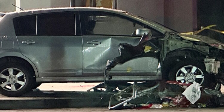 A vehicle that plunged into a crowd outside a nightclub, injuring dozens, is seen on Santa Monica Boulevard in the East Hollywood neighborhood of Los Angeles, California, U.S., July 19, 2025. REUTERS/Jorge Garcia