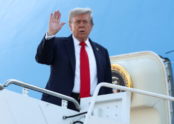 U.S. President Donald Trump boards Air Force One as he departs for Alaska to meet with Russian President Vladimir Putin to negotiate for an end to the war in Ukraine, from Joint Base Andrews in Maryland, U.S., August 15, 2025. REUTERS/Kevin Lamarque