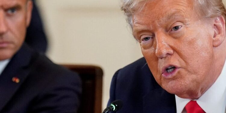 U.S. President Donald Trump speaks during a meeting with French President Emmanuel Macron, Ukrainian President Volodymyr Zelenskiy (not pictured) and European leaders amid negotiations to end the Russian war in Ukraine, at the White House in Washington, D.C., U.S., August 18, 2025. REUTERS/Al Drago