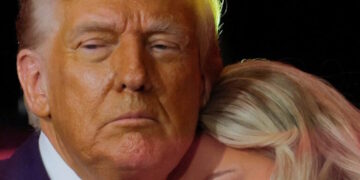 Erika Kirk, wife of slain conservative commentator Charlie Kirk and the new CEO of Turning Point USA, reacts next to U.S. President Donald Trump during a memorial service at State Farm Stadium, in Glendale, Arizona, U.S., September 21, 2025.  REUTERS/Brian Snyder