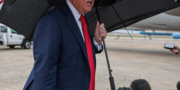 U.S. President Donald Trump speaks to the media before boarding Air Force One, as he departs for Israel, at Joint Base Andrews, Maryland, U.S., October 12, 2025. REUTERS/Evelyn Hockstein