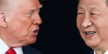 U.S. President Donald Trump and Chinese President Xi Jinping talk as they leave after a bilateral meeting at Gimhae International Airport, on the sidelines of the Asia-Pacific Economic Cooperation (APEC) summit, in Busan, South Korea, October 30, 2025. REUTERS/Evelyn Hockstein