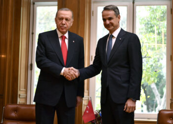 Greece's Prime Minister Kyriakos Mitsotakis, right, shakes hands with Turkey's President Recep Tayyip Erdogan at Maximos Mansion in Athens, Greece, Thursday, Dec. 7, 2023. Erdogan arrived in Greece on a visit designed to set the historically uneasy neighbors on a more constructive path and help repair strained his country's strained relationship with the European Union. (AP Photo/Michael Varaklas)