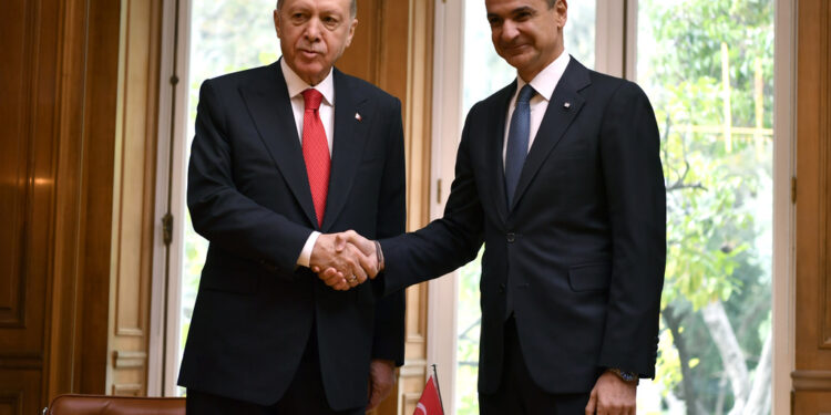 Greece's Prime Minister Kyriakos Mitsotakis, right, shakes hands with Turkey's President Recep Tayyip Erdogan at Maximos Mansion in Athens, Greece, Thursday, Dec. 7, 2023. Erdogan arrived in Greece on a visit designed to set the historically uneasy neighbors on a more constructive path and help repair strained his country's strained relationship with the European Union. (AP Photo/Michael Varaklas)