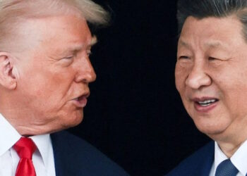 FILE PHOTO: U.S. President Donald Trump and Chinese President Xi Jinping talk as they leave after a bilateral meeting at Gimhae International Airport, on the sidelines of the Asia-Pacific Economic Cooperation (APEC) summit, in Busan, South Korea, October 30, 2025. REUTERS/Evelyn Hockstein/File Photo