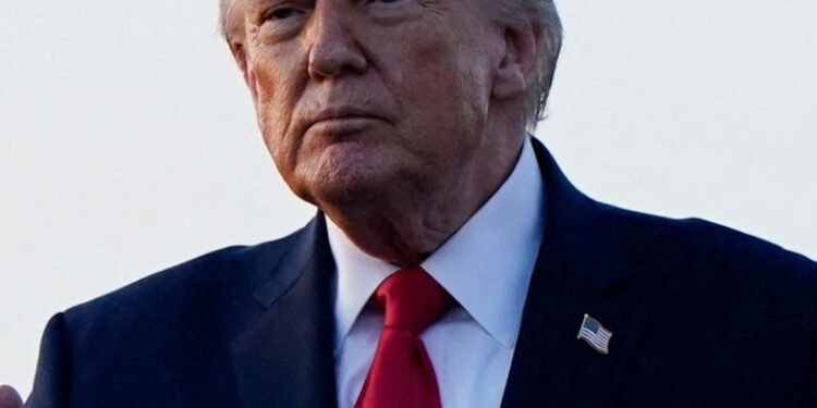 U.S. President Donald Trump gestures as he arrives at Palm Beach International Airport in West Palm Beach, Florida, U.S., February 13, 2026. REUTERS/Elizabeth Frantz