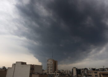 epa12803023 Smoke rises from Tehran’s oil refinery following last night airstrike in Tehran, Iran, 08 March 2026. A joint Israeli and US military operation continues to target multiple locations across Iran since the early hours of 28 February 2026.  EPA/ABEDIN TAHERKENAREH