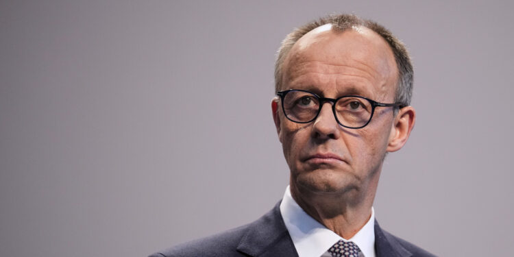 Friedrich Merz, Christian Democratic Union party chairman, addresses the media after reaching an agreement between their parties on a coalition for a new German government at a news conference in Berlin, Germany, Wednesday, April 9, 2025. (AP Photo/Ebrahim Noroozi)