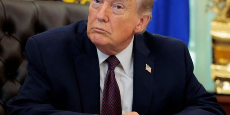 U.S. President Donald Trump attends to sign an executive order in the Oval Office of the White House in Washington, D.C., March 31, 2026.  REUTERS/Evan Vucci