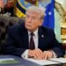 U.S. President Donald Trump attends to sign an executive order in the Oval Office of the White House in Washington, D.C., March 31, 2026.  REUTERS/Evan Vucci