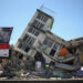 Residents and emergency personnel inspect the site of a collapsed building after an earthquake, in Dosquebradas, Colombia, August 10, 2026. REUTERS/Juan David Duque