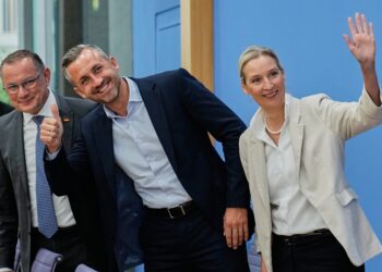 Co-leaders of Alternative for Germany party, or AfD, Alice Weidel, right, and Tino Chrupalla, left, and top candidate for the Saxony-Anhalt state elections Ulrich Siegmund, center, attend a press conference in Berlin, Germany, Monday, Sept. 7, 2026. (AP Photo/Ebrahim Noroozi)