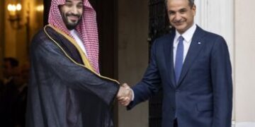 Greek Prime Minister Kyriakos Mitsotakis, right, shakes hands with Saudi Crown Prince Mohammed bin Salman during a welcoming ceremony, in Athens, Tuesday, July 26, 2022. Crown Prince Mohammed bin Salman is visiting Greece Tuesday on his first trip to a European Union country since the killing in 2018 of Saudi journalist Jamal Khashoggi. (AP Photo/Yorgos Karahalis, Pool)