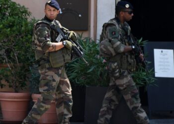 Two soldiers of the French military walk through the city before the UEFA EURO 2016 quarter final soccer match between Poland and Portugal at the Stade Velodrome in Marseille, France, 30 June 2016. Photo by: Federico Gambarini/picture-alliance/dpa/AP Images
