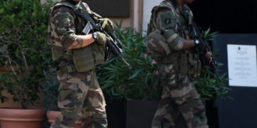 Two soldiers of the French military walk through the city before the UEFA EURO 2016 quarter final soccer match between Poland and Portugal at the Stade Velodrome in Marseille, France, 30 June 2016. Photo by: Federico Gambarini/picture-alliance/dpa/AP Images